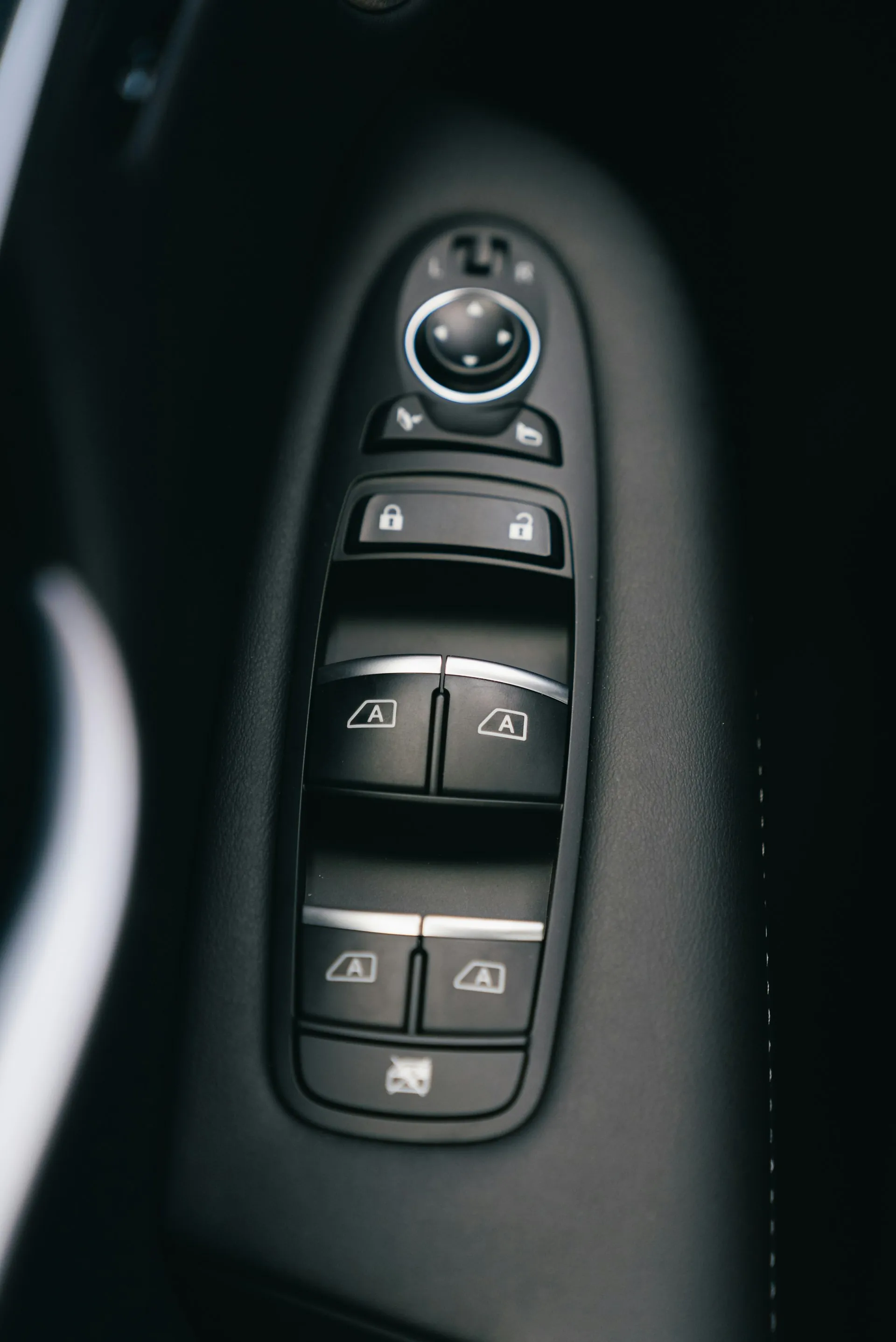Car door panel with power window and lock switches